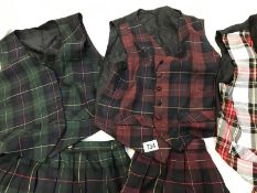 Three sets of Tartan skirts with matching waistcoats size 14 / M