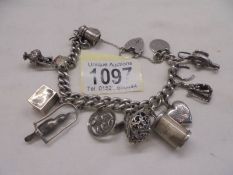 A silver charm bracelet with mainly silver charms.