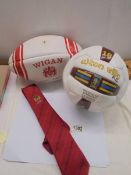 A signed Aston Villa 1990/01 season football, A signed Wigan Rugby league ball and a Wigan tie.