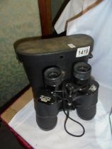 A cased pair of binoculars.