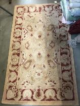 Cream/brown and red pattern rug 90 x 154 cm approx