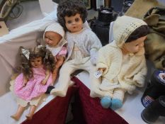 Four mid-20th century dolls.