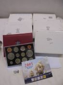 Six boxed de-luxe proof coin sets in cases and with booklets etc.,