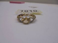 A diamond and citrine yellow gold ring, size N, 1.8 grams.