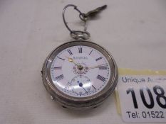 A ladies silver fob watch, Birmingham 1944/45, in working order with key (missing glass).