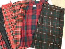 12 Tartan Skirts. Various sizes & colours