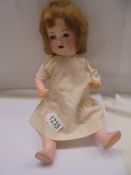 A 19th century Armand Marseille Germany 990 A-2-M porcelain doll.