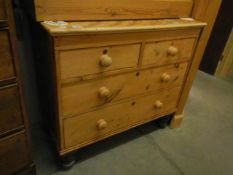 A pine two over two drawer chest on turned feet, COLLECT ONLY.