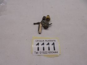 A miniature Victorian bone monocular stanhope, a miniature penknife and other charms for bracelet.