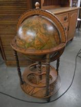 A vintage globe drinks cabinet. COLLECT ONLY.