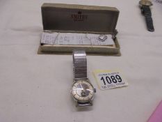 A vintage boxed Smiths de-luxe 15 jewel wrist watch.
