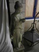 A Grecian lady garden statue on plinth, 160 cm tall. COLLECT ONLY.