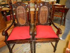 A pair of 19/20th century oak carver chairs with bergere panels. COLLECT ONLY