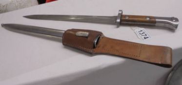 A No.7 Mk1/L bayonet by Elkington (sight ring removed) in period scratch made scabbard.