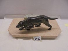 A bronze? hunting dog on a marble base as a photo frame.