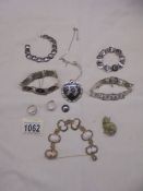 A good lot of silver bracelets, pendant etc.,