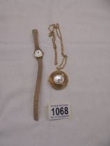 A ladies wrist watch and a pendant watch.