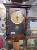 An Edwardian oak wall clock. COLLECT ONLY.