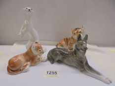 Four USSR porcelain animals being tiger cub, lion cub, dog and otter.
