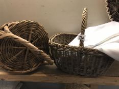 Two wicker baskets and quantity of curtains. White with blue flower