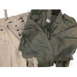 Flight suit and pair of tan coloured shorts