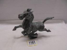 A cast metal horse.