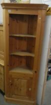 A single door pine corner cabinet with open shelf top. 190H x 70W x 44D. COLLECT ONLY.