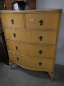 A serpentine front chest of drawers. COLLECT ONLY.