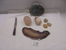 Two marble eggs and other stone items.