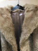 Sheepskin / fur coat. Styled by Tona