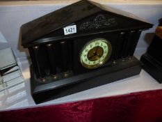 A heavy black slate paladian style mantel clock, COLLECT ONLY.