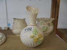 An unboxed Belleek vase and two Belleek plant pots.