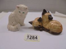 A Goebel cat figure and a Beswick figure of two Siamese kittens marked 1296.