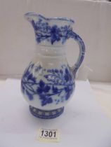 An early Victorian blue and white jug with lozenge mark.