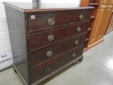 An early 20th century two over three chest of drawers with brass furniture (1 plate missing),
