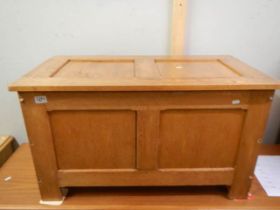 A paneled light oak blanket box with hinged lid, 53H x 90W x 49D. COLLECT ONLY.