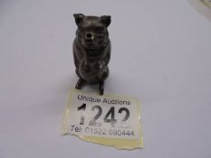 A Victorian 'Go-to-bed' brass vesta in the form of a pig.