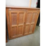 A Victorian oak school cupboard with three shelves (later back), 123 cm tall x 125 cm wide x 42 cm d