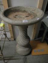 A stone effect pedestal bird bath standing 83 cm high, COLLECT ONLY.