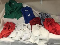 A quantity of ladies shirts with ties neck. various colours