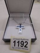 18ct white gold two piece cross pendant set with square calibre-cut sapphires and RBC diamonds