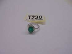 18ct white gold ring set with an oval emerald & surrounded by baguette cut diamonds. Emerald 2.04ct
