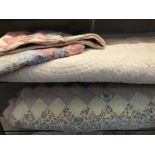 2 large bed throws. 1x patchwork with 2 pillowcase and 1x cream