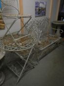 A mid 20th century English garden ironwork table, two chairs and bench, COLLECT ONLY.