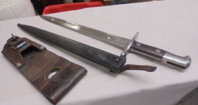 A German K98 bayonet in scabbard.