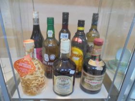 A bottle of cherry brandy, Drambuie, White port, Gin Liqueur, Kahlua and three other bottles,