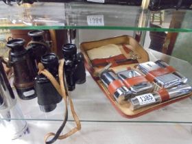Two pairs of binoculars and a Gents shaving set.