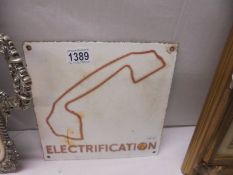 A metal 'Electrication' sign.