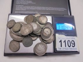 Approximately 110 grams of silver coins.