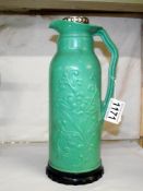 A vintage green bakelite 'British Vacuum Flask Co.,' hot water flask.